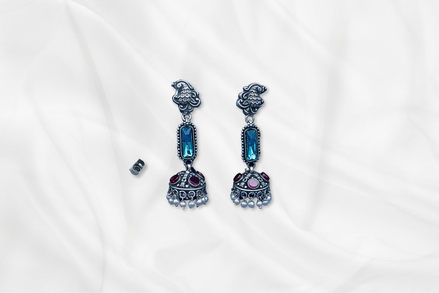 Blue Radiance Oxidized Silver Jhumkas With Gem Accents