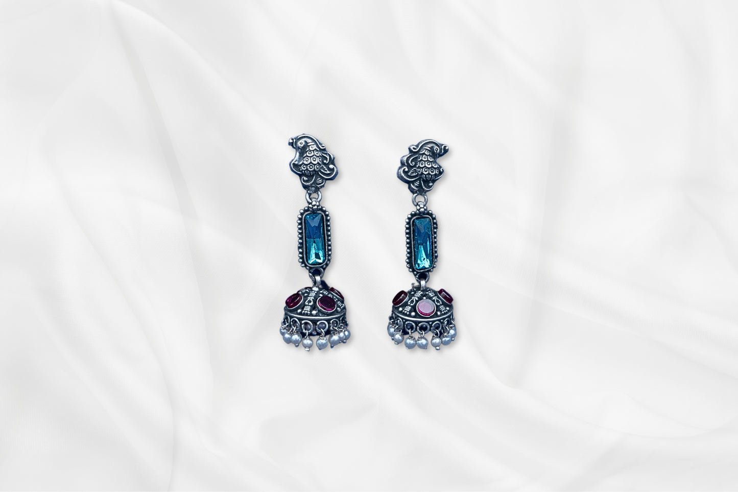 Blue Radiance Oxidized Silver Jhumkas With Gem Accents