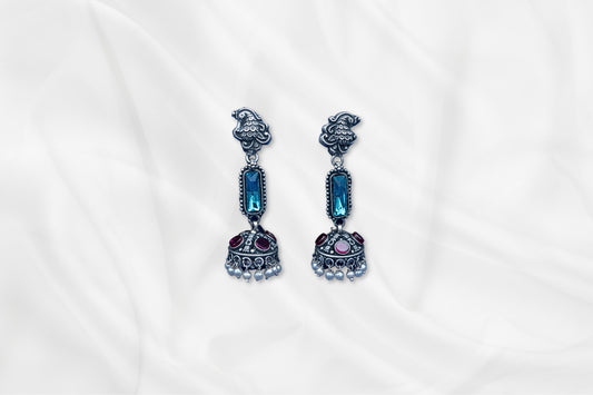 Blue Radiance Oxidized Silver Jhumkas With Gem Accents